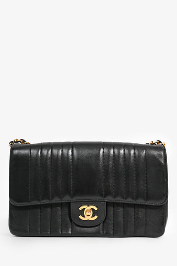 Chanel™ 1991-94 Vintage Black Vertical Quilted Lambskin Medium CC Flap Bag